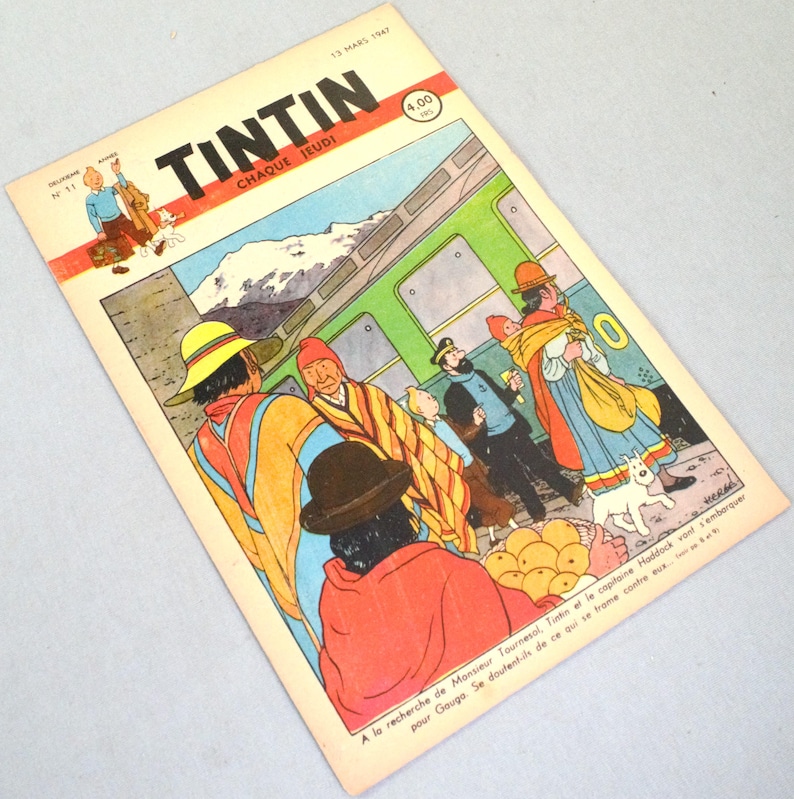 K&ouml;nnte beinhalten: Ein Vintage-Tintin-Comic-Cover vom 13. M&auml;rz 1947 mit einer farbenfrohen Illustration von Figuren in traditioneller andiner Kleidung neben einem gr&uuml;nen Zug. Der Titel Tintin ist oben in fetten schwarzen Buchstaben gedruckt.
