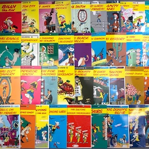 May include: A collection of vintage Lucky Luke comic books. The covers feature colorful illustrations of cowboys, horses, and various scenes from the Wild West. Titles include "Billy the Kid," "Daltons," and "Rails on the Prairie."