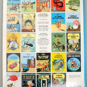 Pode incluir: Uma cole&ccedil;&atilde;o de capas de banda desenhada de Tintin, apresentando v&aacute;rias aventuras. As capas exibem ilustra&ccedil;&otilde;es coloridas e t&iacute;tulos em franc&ecirc;s, incluindo "Tintin au Congo" e "Les Cigares du Pharaon". Os livros est&atilde;o dispostos numa grelha.