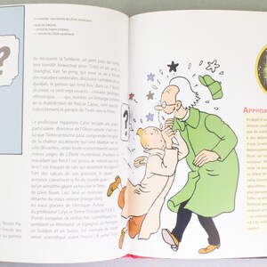 May include: An open book featuring comic illustrations. One panel shows a man in a suit gesturing at a young man with a dog, with the text "D&eacute;crocher Lune". Another panel depicts two men and a dog. A spider illustration is also visible.