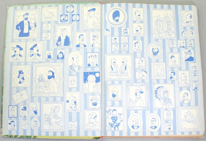 May include: Open book pages with numerous blue and white illustrations of portraits and figures. The images are framed and arranged on a striped background. The illustrations vary in size and style, creating a visually engaging layout.