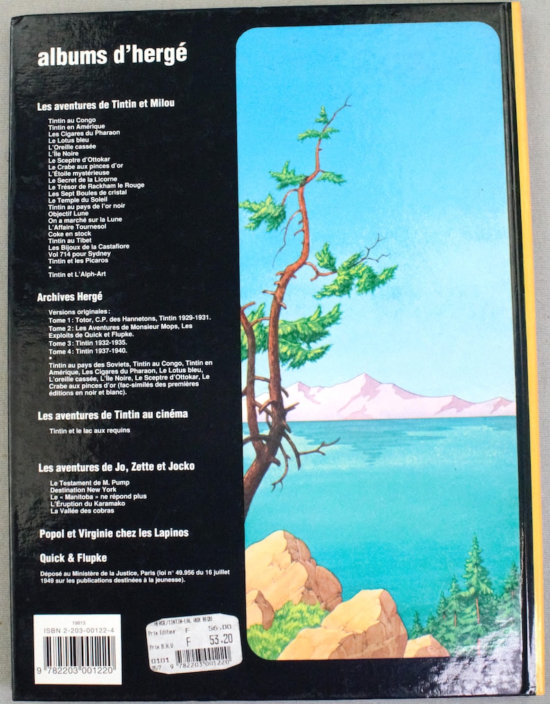 May include: Back cover of a book featuring a scenic illustration of a lake, mountains, and trees. The book's title is "albums d'herg&eacute;" with a list of Tintin adventures in French. The book has a black spine and a yellow border.