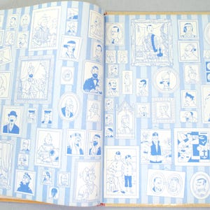 May include: Open book with pages featuring numerous blue and white illustrations of portraits and figures. The images are framed and arranged on a striped background, creating a gallery-like display.