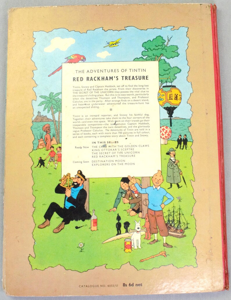 May include: The back cover of a vintage comic book titled "The Adventures of Tintin: Red Rackham's Treasure." The cover features colorful illustrations of characters and scenes from the story, including Tintin, Snowy, and Captain Haddock. The book is in English.