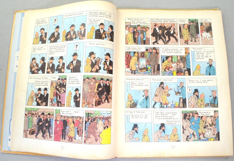 May include: Open book with comic strip illustrations. The pages display panels with characters in suits and hats, engaging in conversations. The comic strip is in color, with speech bubbles and sequential storytelling.
