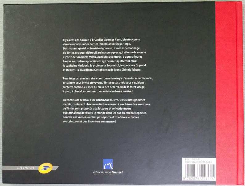May include: A book cover with a black background and white text in French. The book has a red spine and a barcode. The text describes the adventures of Tintin, a comic book character. The book is published by &Eacute;ditions Moulinsart.