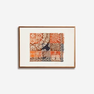 May include: Framed artwork featuring a patchwork design with floral and architectural motifs in shades of orange, navy, and white. The artwork is displayed in a brown wooden frame, adding a touch of warmth and elegance to the piece.