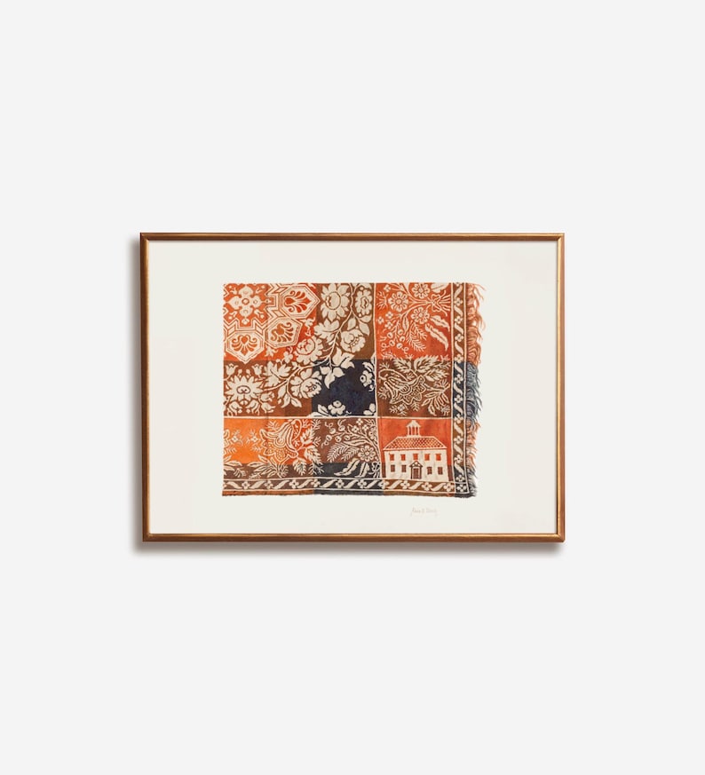 May include: Framed artwork featuring a patchwork design with floral and architectural motifs in shades of orange, navy, and white. The artwork is displayed in a brown wooden frame, adding a touch of warmth and elegance to the piece.