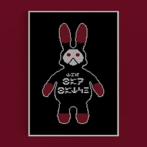 Puede incluir: Una imagen pixelada en blanco y negro de un conejo rojo con una sudadera negra con el texto "WE'RE OK" en la parte delantera. El conejo tiene ojos rojos y orejas rojas.