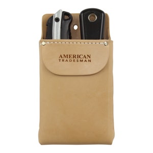 May include: A tan leather utility belt pouch with the text "AMERICAN TRADESMAN" embossed on the front. The pouch has two slots for holding tools, one of which is holding a silver and black utility knife.