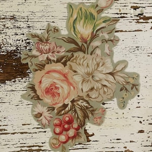 May include: A floral design featuring a bouquet of roses, peonies, and other flowers in shades of pink, peach, and cream, with green and brown leaves. The design is set against a light green background.