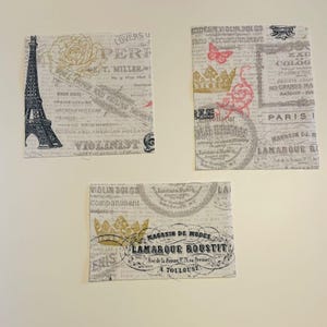 May include: Three fabric squares with a vintage Parisian theme. Each square features a collage of text, floral designs, and iconic imagery like the Eiffel Tower and crowns. The color palette includes beige, black, gold, and pink.