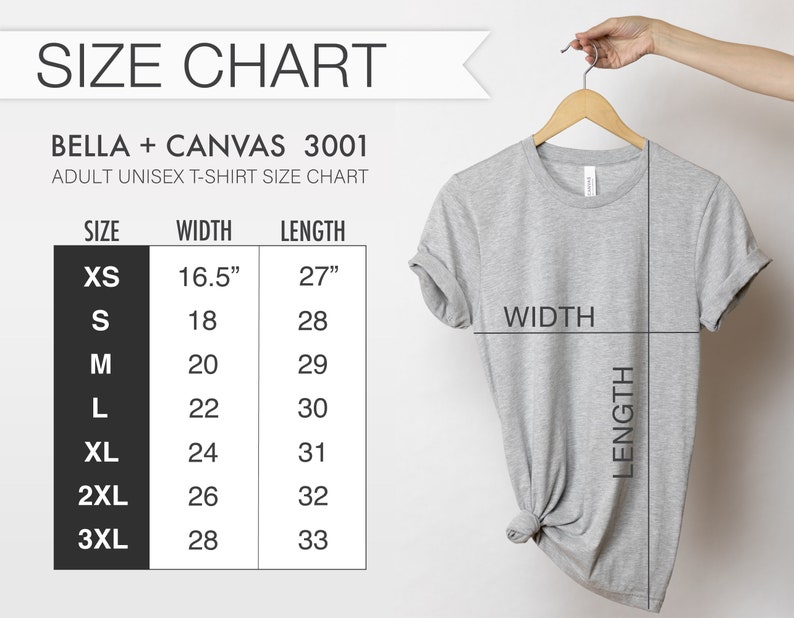 May include: A light gray Bella + Canvas 3001 adult unisex t-shirt hanging on a wooden hanger. The image includes a size chart with measurements in inches for XS to 3XL sizes. The chart shows width and length measurements.