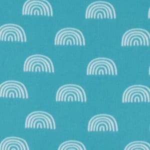 May include: A turquoise fabric with a white repeating pattern of rainbows.