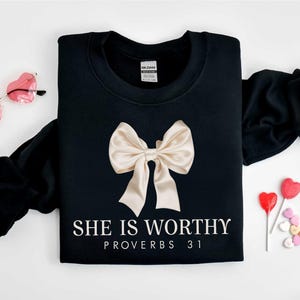 Christian Shirt,
Best Religion Tshirt,
Coquette Bow Shirt,
bible shirt,
bible verse shirt,
religious shirt,
faith shirt,
she is worthy shirt,
womens tshirts fall,
Women's Christian,
Christian Coquette,
Girly Faith Shirt,
Christian Bow Shirt