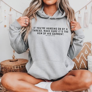 If You&#39;re Hanging On By A Thread Hoodie Make Sure It&#39;s the hem of His Garment Hoodie Bible Verse Shirt Faith Based Religious Gift