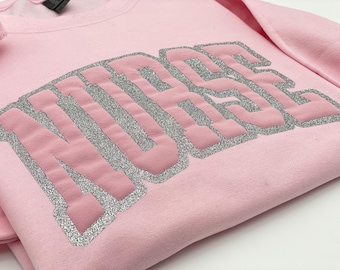 Nurse Glitter Puff Shirt: Retro Varsity Style, Oversized Soft Fit