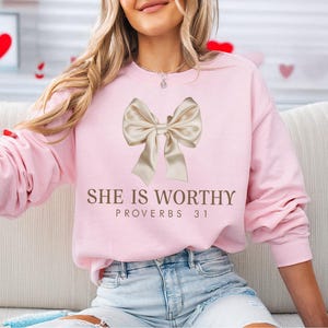 Christian Shirt,
Best Religion Tshirt,
Coquette Bow Shirt,
bible shirt,
bible verse shirt,
religious shirt,
faith shirt,
she is worthy shirt,
womens tshirts fall,
Women's Christian,
Christian Coquette,
Girly Faith Shirt,
Christian Bow Shirt