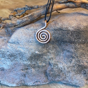 Handmade spiral pendant made of hammered copper. Koru