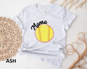 May include: A gray t-shirt with the text "Mama" and a yellow softball with a pink and leopard print design.