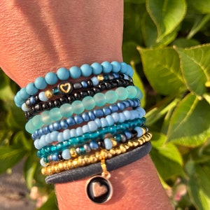 Stackable bracelets set of 10 in blue tones.