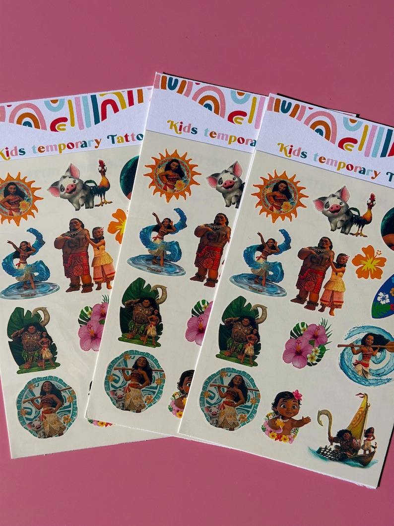May include: Three packs of kids temporary tattoos featuring characters from a popular animated movie. Each pack has a white background with colorful illustrations of characters, flowers, and a boat. The text "Kids temporary Tattoos" is printed at the top of each pack.