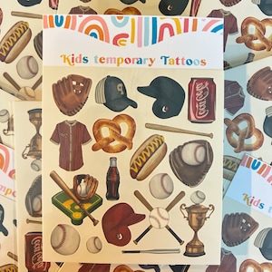 May include: A sheet of temporary tattoos featuring baseball-themed images, including a baseball glove, a baseball cap, a baseball bat, a pretzel, a hot dog, a Coca-Cola can, and a trophy. The sheet is labeled "Kids temporary Tattoos".