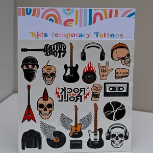 May include: A sheet of children's temporary tattoos with rock and roll designs. The designs include guitars, skulls, headphones, and the words "ROCK AND ROLL" and "GUITAR GODS?" in various colours. The top of the sheet has a rainbow design and the words "Kids temporary Tattoos".