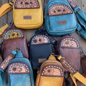 Small sling bags with hand tooled leather patches