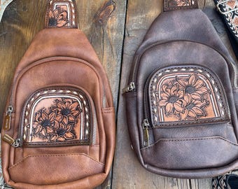 Sling bag with hand tooled floral leather patchs