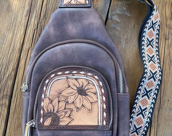 Sling bag with hand tooled floral leather patchs