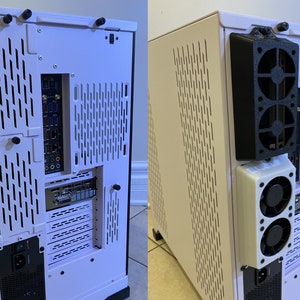 May include: A white computer case with black accents and a black fan assembly attached to the back. The case has a perforated design and various ports and connectors visible. The computer case is designed for housing computer components.