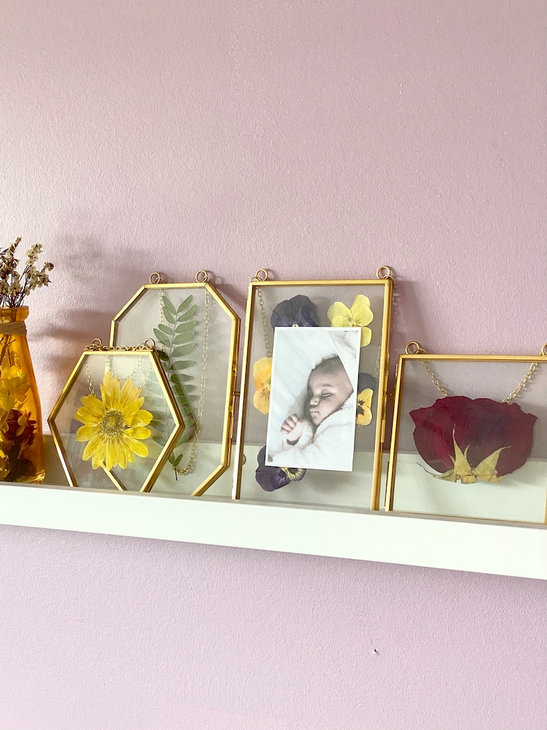 A set of 4 gold picture frames containing a 4x4 square, 4x6 octagon, 4x6 rectangle and a small hexagon. Elegant yet minimalistic decor for your home. Perfect for creating little thoughtful gifts for your loved ones.
