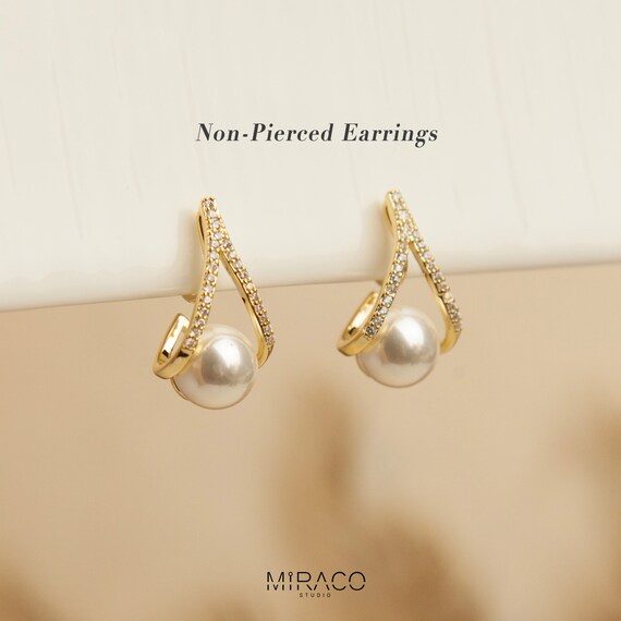 Clip-On Earrings Two-tone Gold and Sterling Silver Pave Cubic Zirconia Non-pierced Clip-On Earrings Two-tone Gold and Sterling Silver Pave Cubic Zirconia Non-pierced