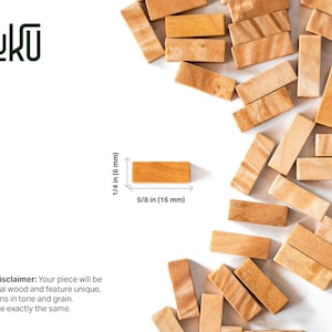 May include: A collection of small rectangular light brown wooden blocks scattered across the frame. One block is isolated with dimension lines showing a height of 1/4 inch and a width of 5/8 inch. The text KUNUKU and a natural wood disclaimer are visible.