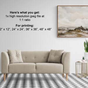 May include: A digital download of a watercolor painting of a landscape with brown and beige tones. The painting is framed and hanging on a white wall above a beige sofa. The text "Here's what you get: 1x high resolution jpeg file at 1:1 ratio For printing: 12" x 12", 24" x 24", 36" x 36", 48" x 48" is printed on the wall below the painting.