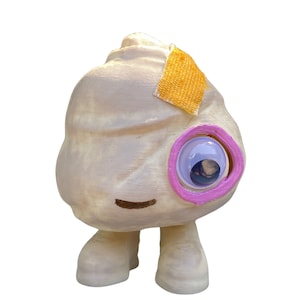 May include: A white, hand-painted, 3D printed toy with a single pink-rimmed eye, a yellow bandage, and two small legs.