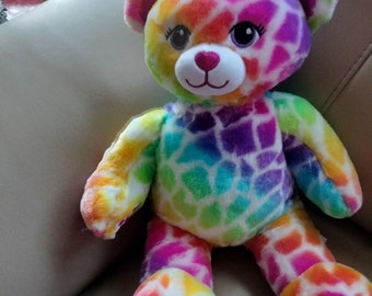 Ours caché BAB style Lisa Frank arc-en-ciel