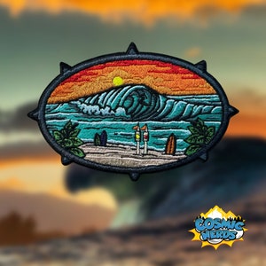 May include: Embroidered patch with a sunset scene over a large wave crashing on a beach. The patch has a black oval outline with a jagged edge and a dark blue background. The wave is a deep blue with white foam and the sunset is orange and yellow. There are two palm trees on the beach and two surfboards.