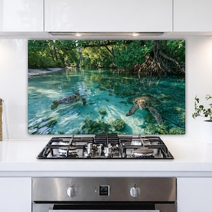 May include: A rectangular kitchen splashback panel featuring a high-resolution photograph of two sea turtles swimming in clear turquoise water near a mangrove forest with visible tree roots and lush green foliage above the water surface.