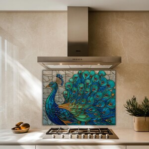 Vibrant peacock stained-glass backsplash in shades of teal and blue, mounted behind a professional gas range in a kitchen with beige marble-textured walls and a stainless steel range hood.