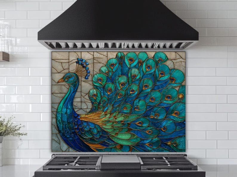 Vibrant peacock stained-glass backsplash in shades of teal and blue, mounted behind a professional black gas range in a kitchen with white subway tile walls and a black tapered range hood.