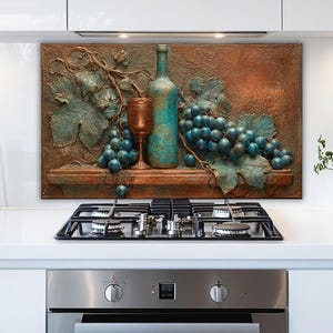 May include: A copper-toned kitchen backsplash featuring a still life of grapes, a wine bottle, and a goblet. The grapes are a deep blue, and the bottle has a teal finish. The artwork is mounted above a gas stovetop.