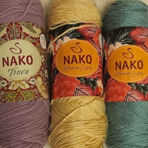 May include: Three skeins of yarn in different colors. The skeins are labeled with the brand name "NAKO" and the yarn names "Truva", "Mona Lisa", and "Mona Lisa".