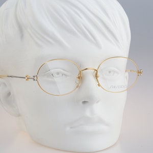 Shiseido 1001 1, Vintage 90s gold unique oval eyeglasses frames womens NOS