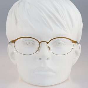 It&#39;s Titanium 603, Vintage 90s laser cut ultra lightweight nylor yellow oval eyeglasses frames women / NOS