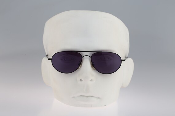 Calvin Klein Small Oval Sunglasses Calvin Klein 1010 Oval Silver Metal Sunglasses W Black Cello  main image 4