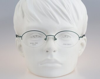 Shiseido 1018 3, Vintage 90s half rim green oval glasses frames womens NOS