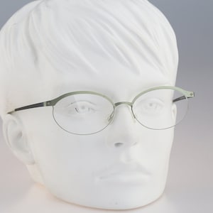 It&#39;s Titanium 603, Vintage 90s laser cut ultra lightweight nylor green oval eyeglasses frames women / NOS