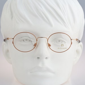Aigner Ea 406 14, Vintage 90s orange and gold small round eyeglasses frames mens & womens NOS
